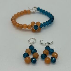 Set orange cat eye, blue  crystal wire
Handmade bracelet and earrings New.